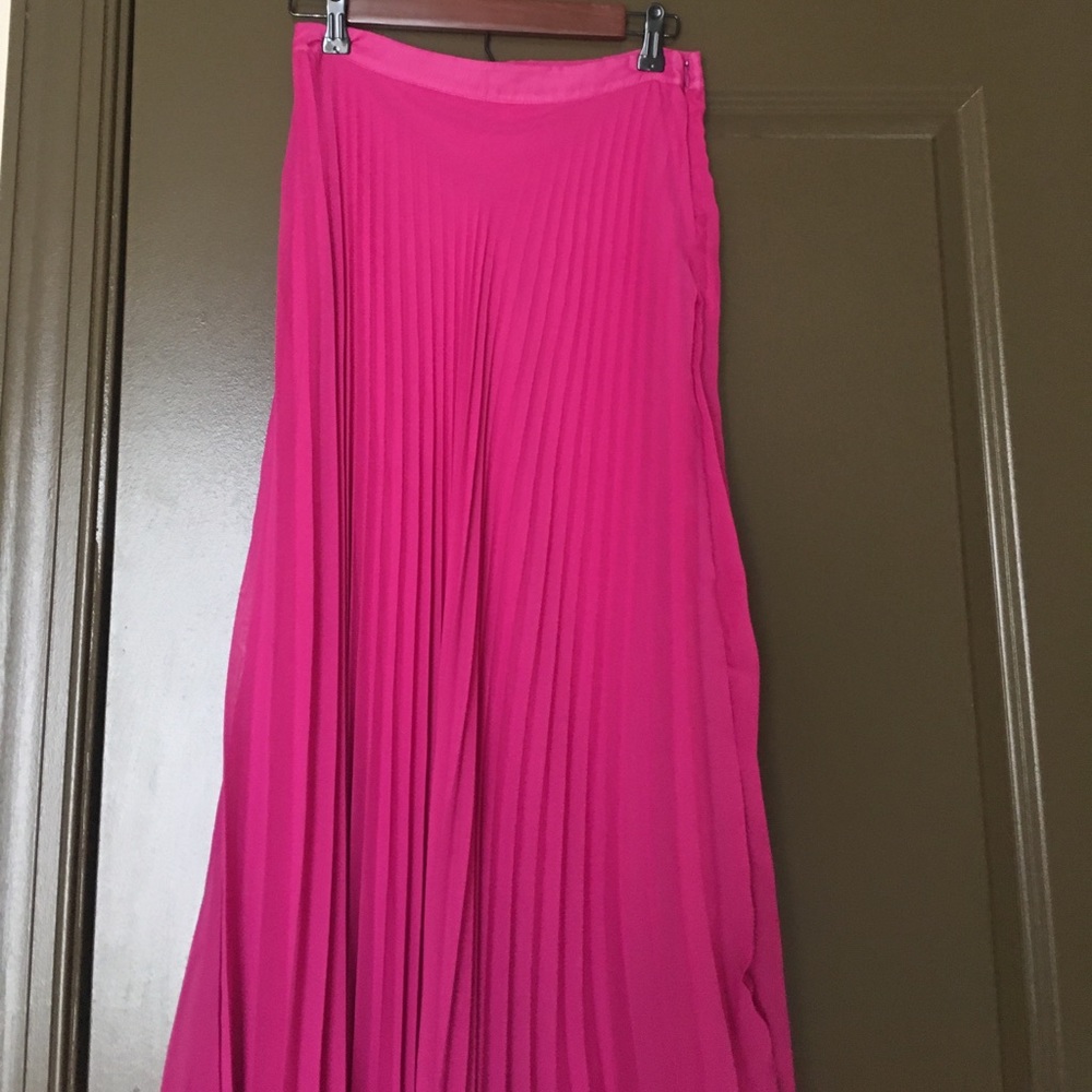 Floor length, pleated magenta maxi skirt