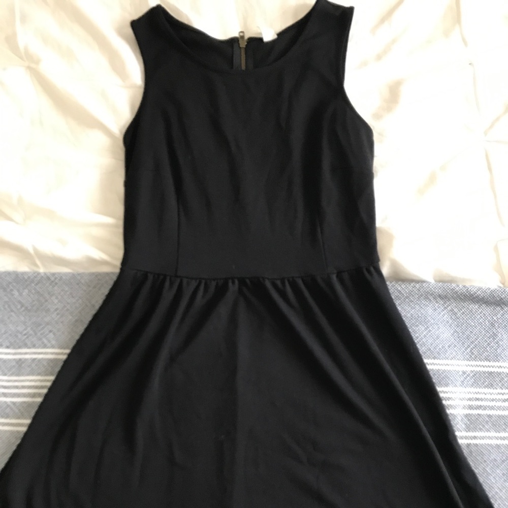 Black sleeveless A-Line dress.