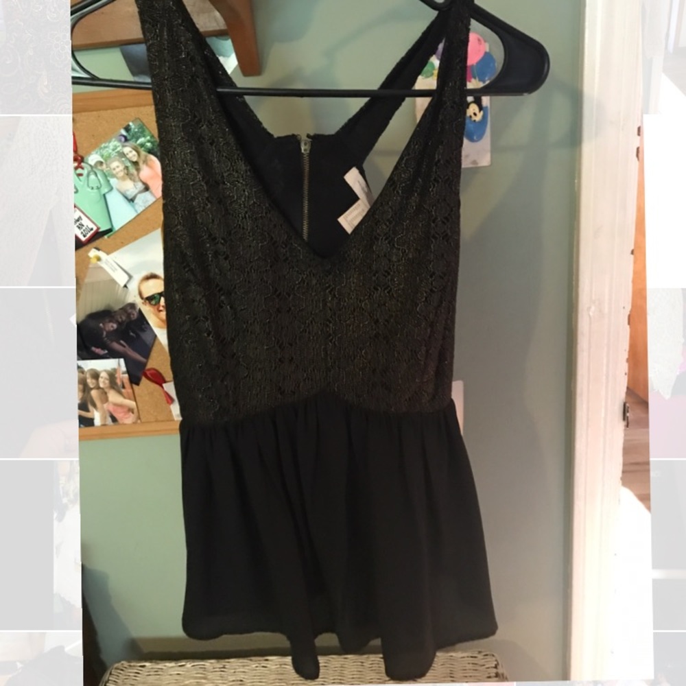 Peplum black and gold top