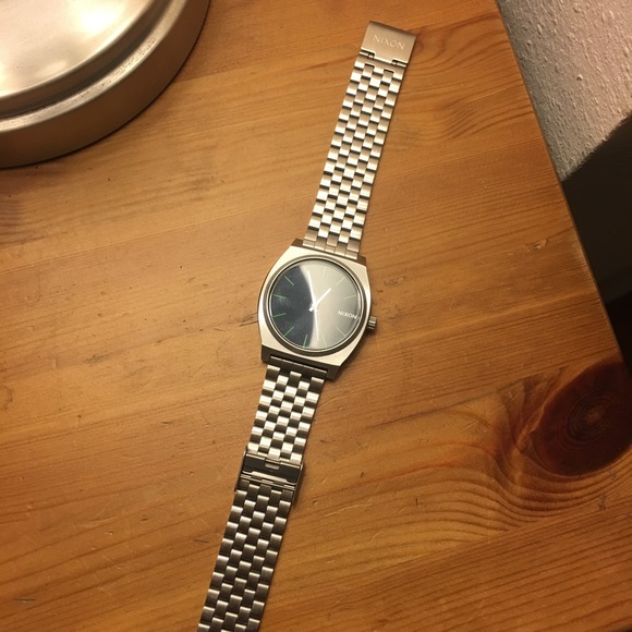 Silver Nixon watch with Navy blue back
