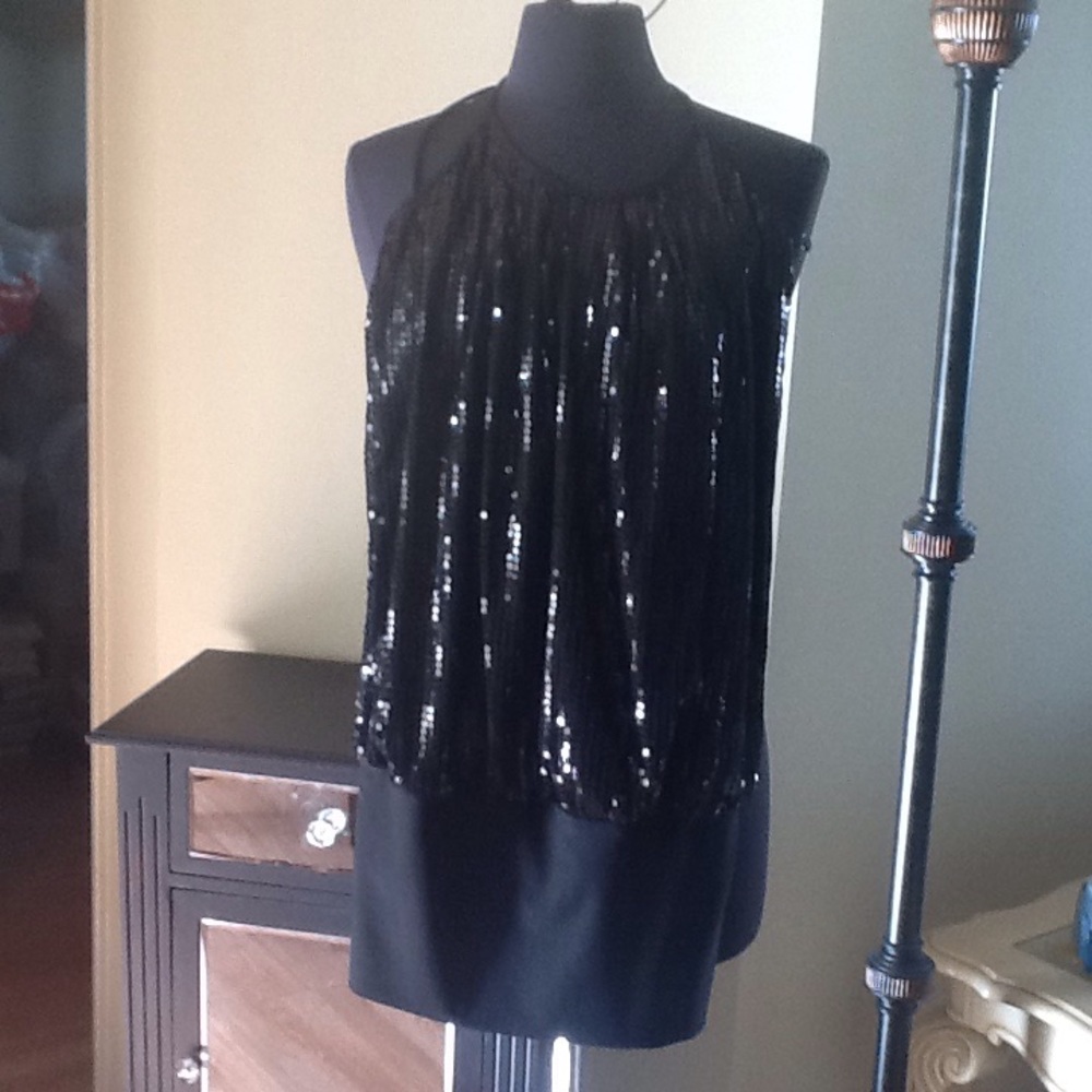 black sequinned sexy sleeveless top or mini dress