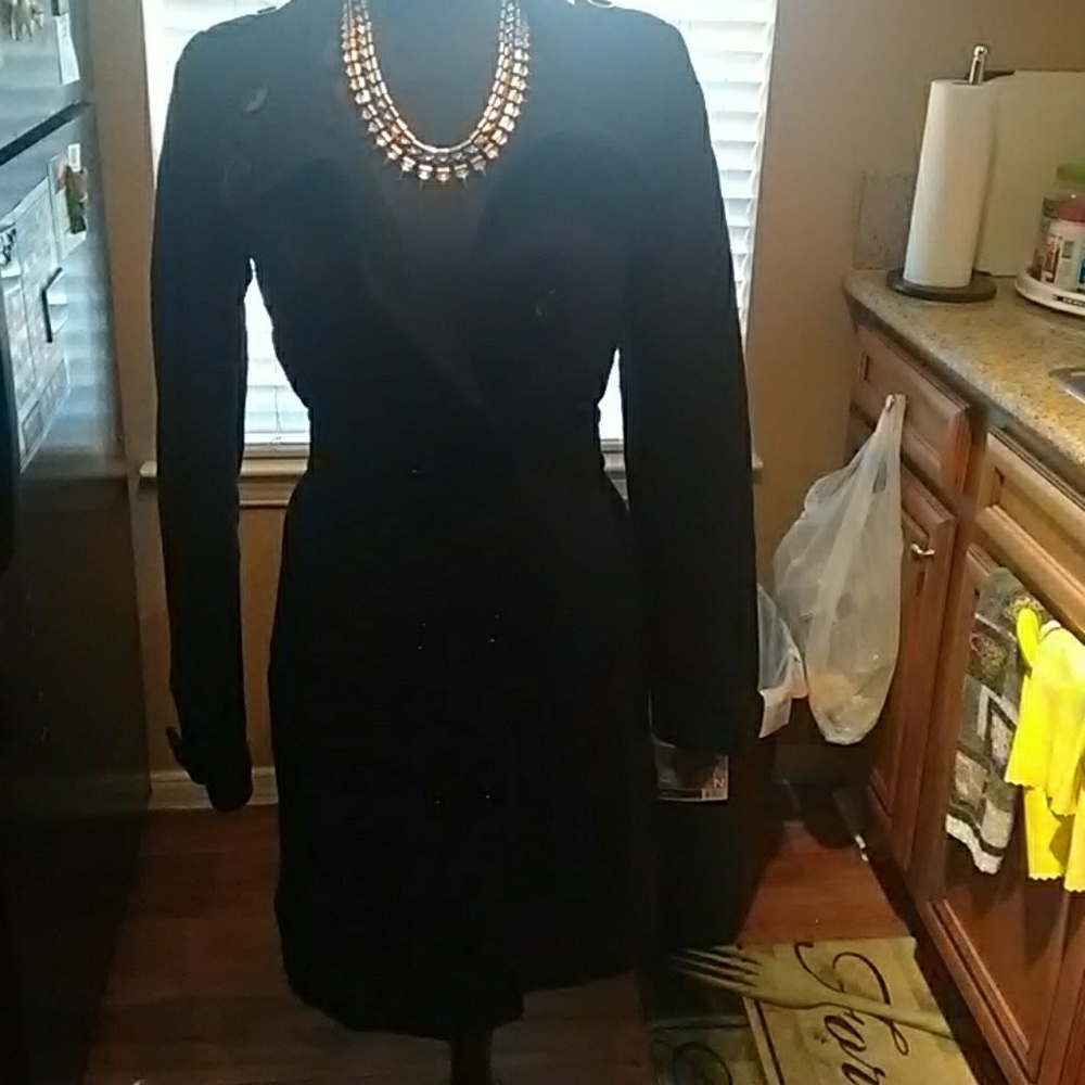 Black coat the coat is washable and a size 4 very