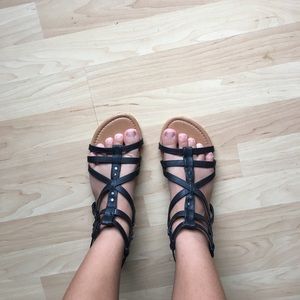 Black and brown gladiator flats