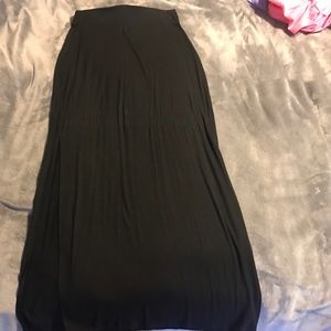 Black long skirt, with a slit in the side.