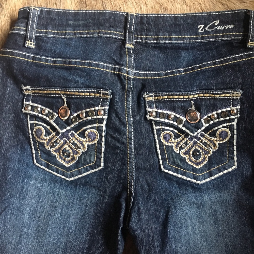 Z curve jeans with embellished pockets