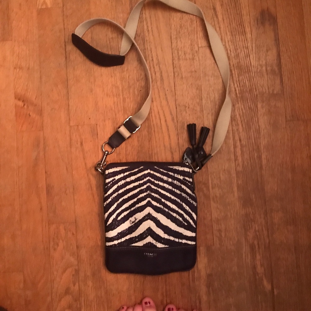 Purple zebra print Coach crossbody