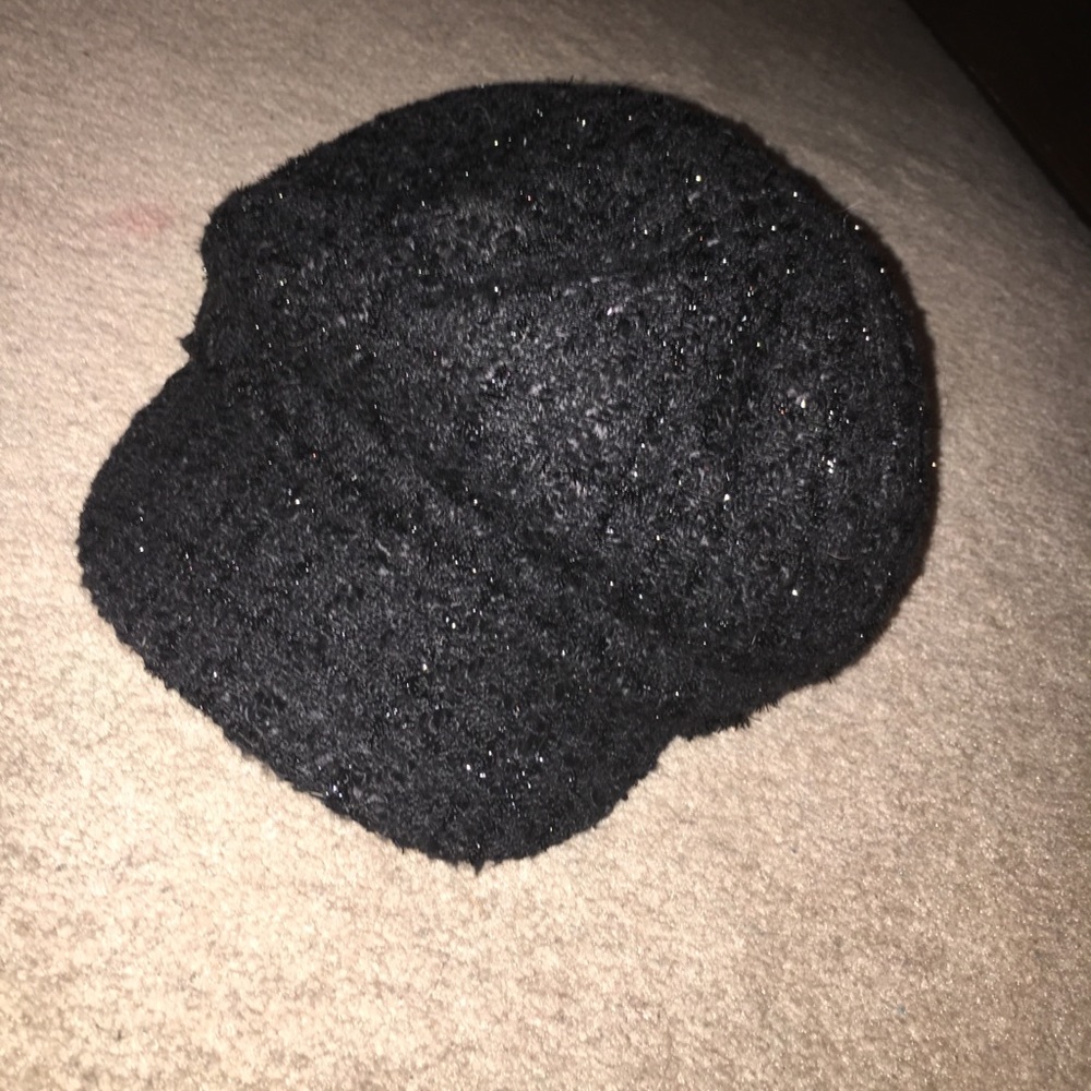 glittery black conductor style hat.