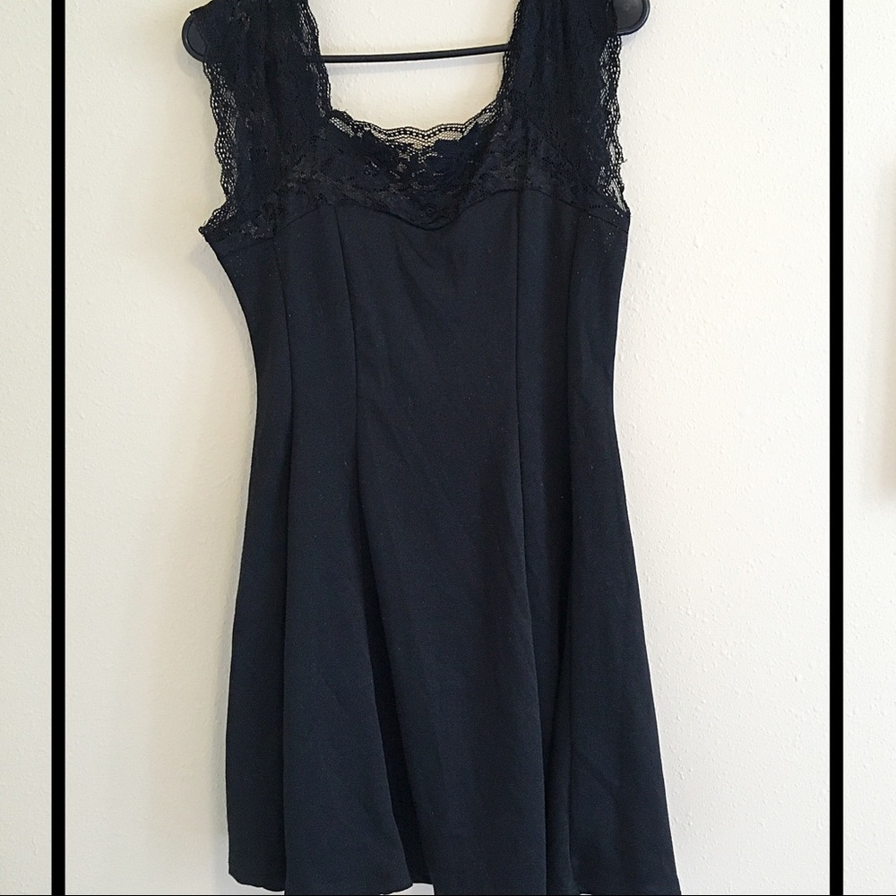 Black dress with lace sleeves and collar