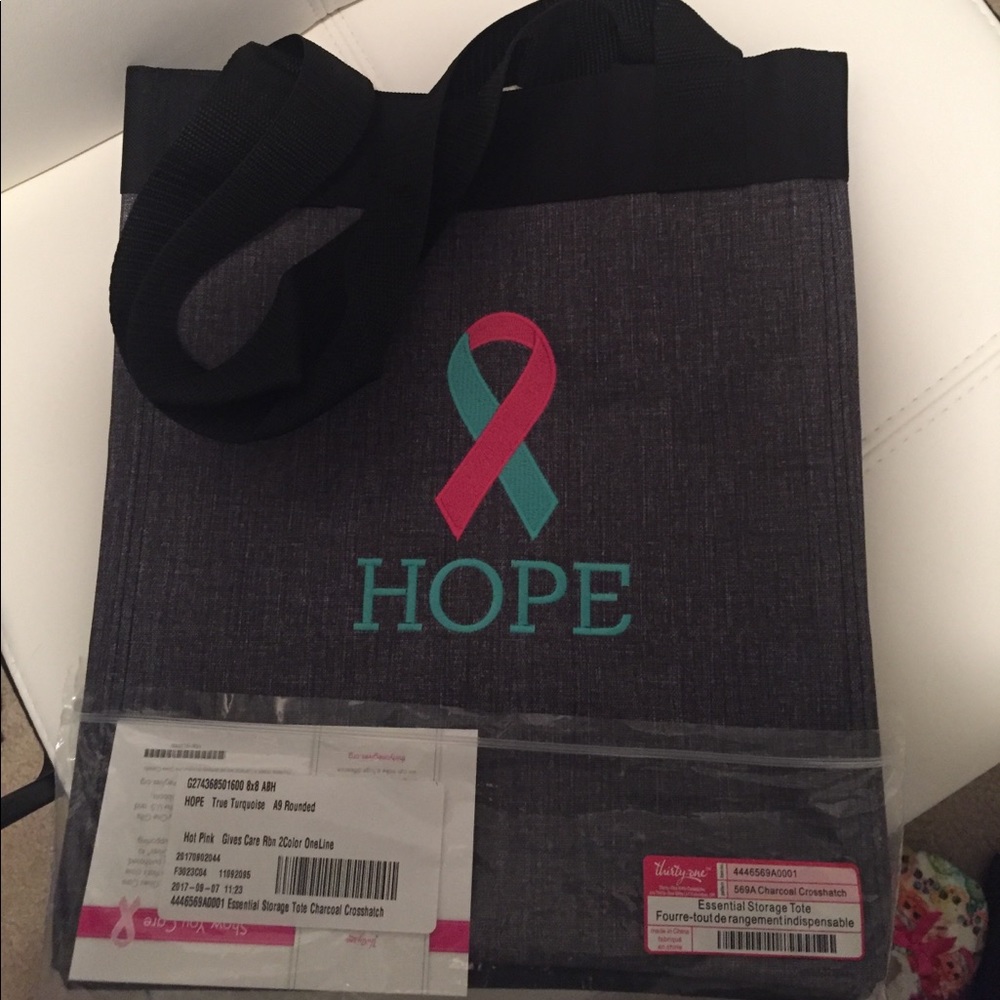 Essential Storage tote with pink and teal ribbon
