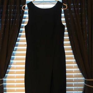 Black fitted dress with a slit