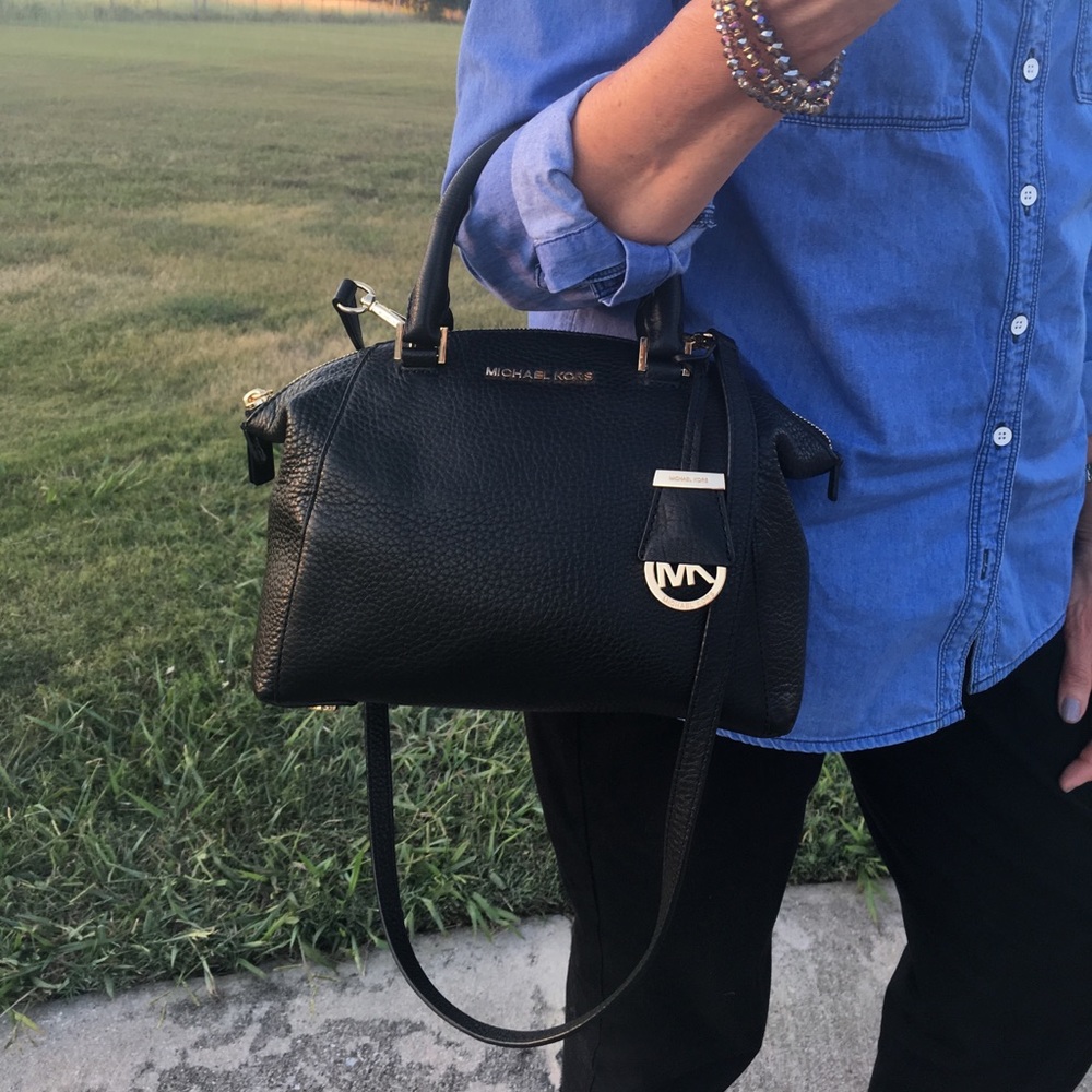 Black Michael Kors Cross body purse.