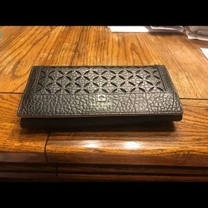 Gently used eyelet perforated leather wallet
