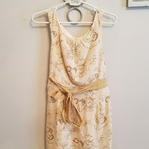 Cream and gold dress with open back