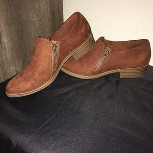 Dark tan ankle booties with zipper accents