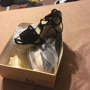 Black ankle wrap wedge sandal.