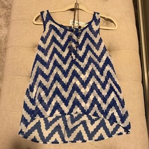 Chevron shirt with attached necklace.