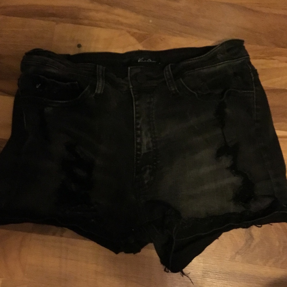 Distressed black jean shorts