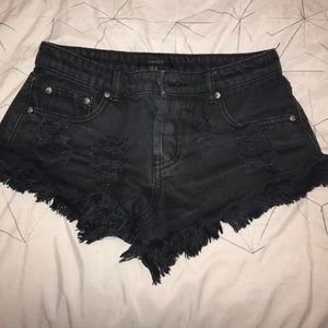 Distressed black shorts