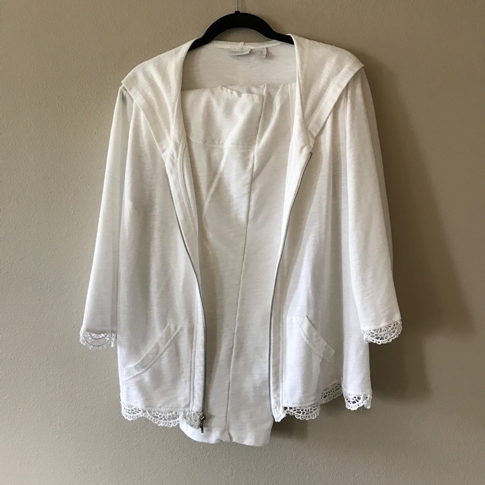 White cropped pants with lace trimmed jacket.