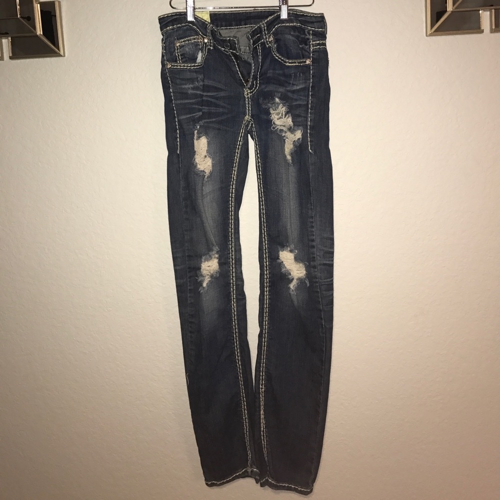 Distressed dark denim jeans