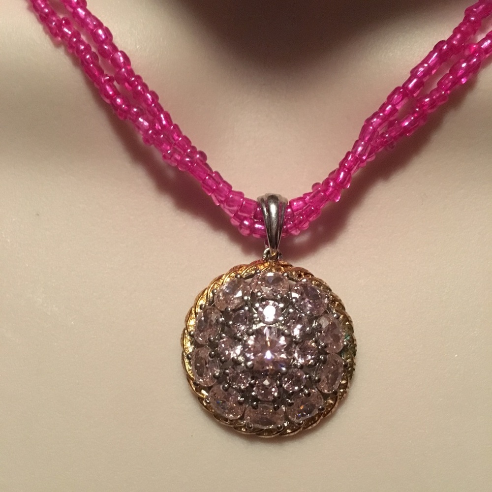 Pink beaded necklace with pink crystal pendant