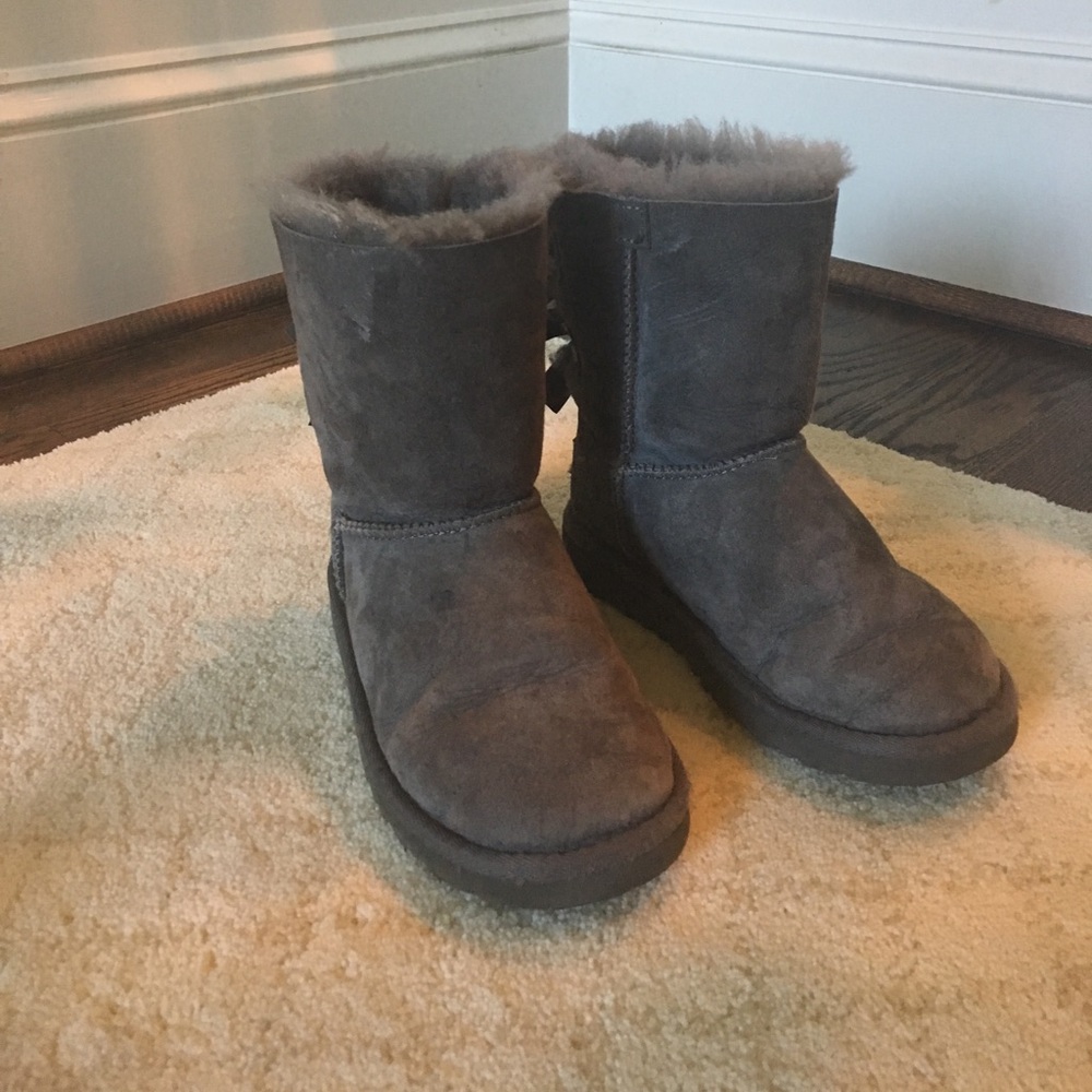Ugg grey boots with bow detail on back.