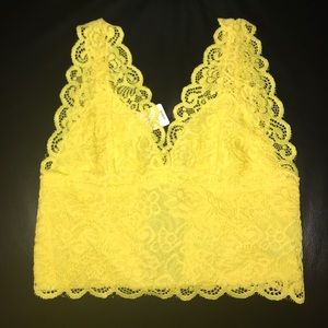 Yellow lace BEBE crop top. NWT.