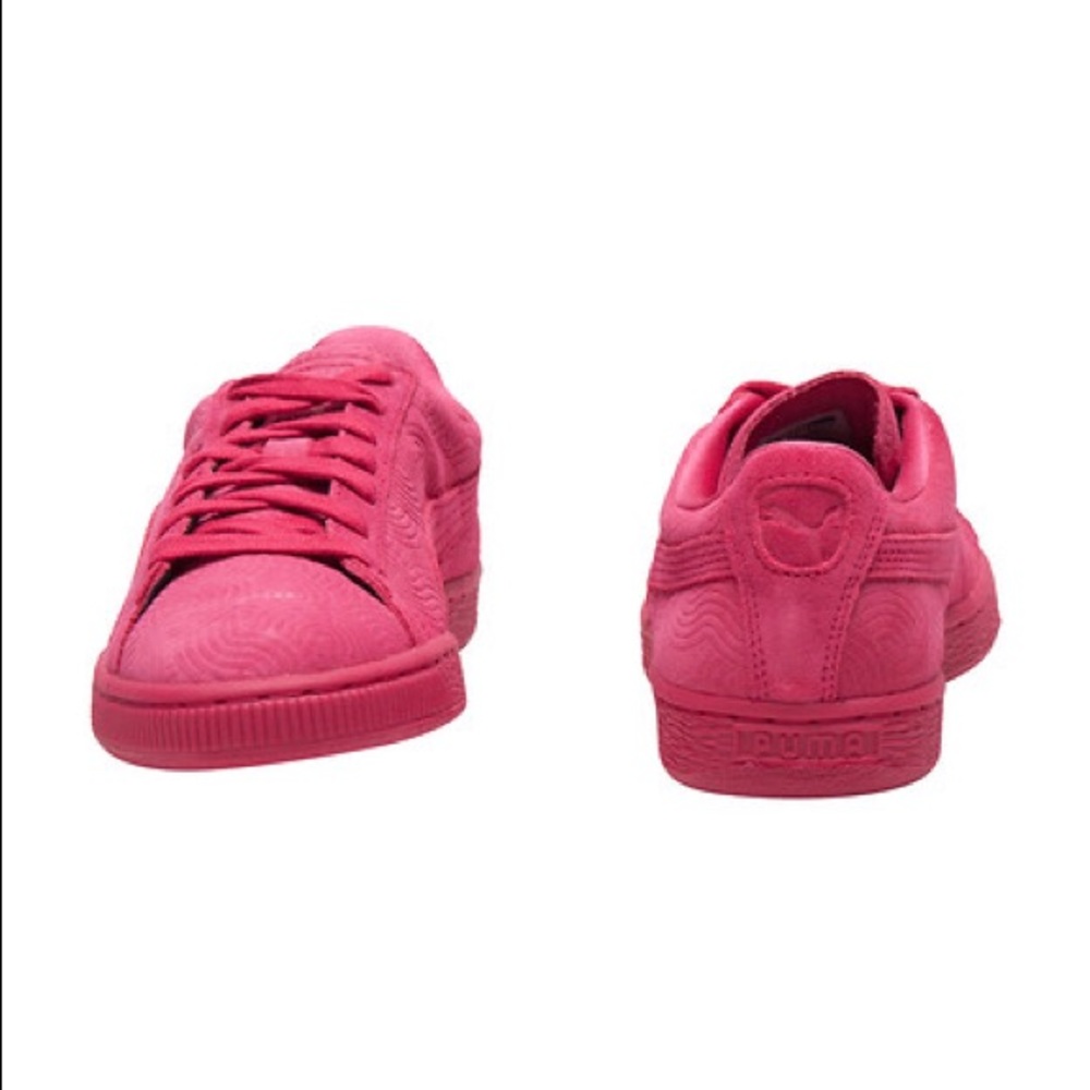 Pink suede pumas