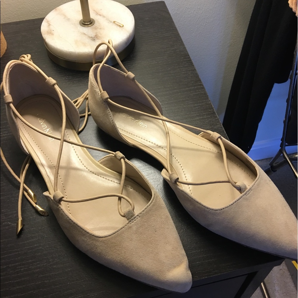 Cream colored Calvin Klein Tie Up flats