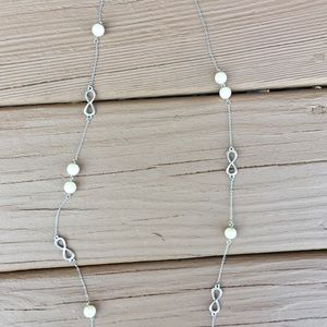 Silver and pearl infinity necklace