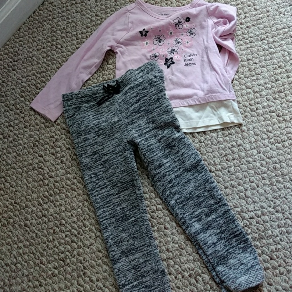 Pants and shirt set shirt has small dot on it.
