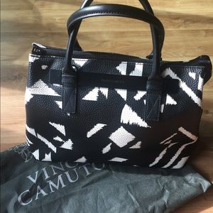 White and black Vince Camuto handbag.