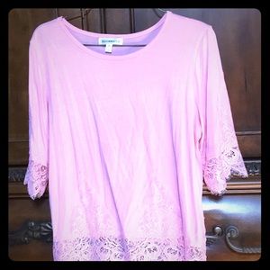 Cute peachy colored top.