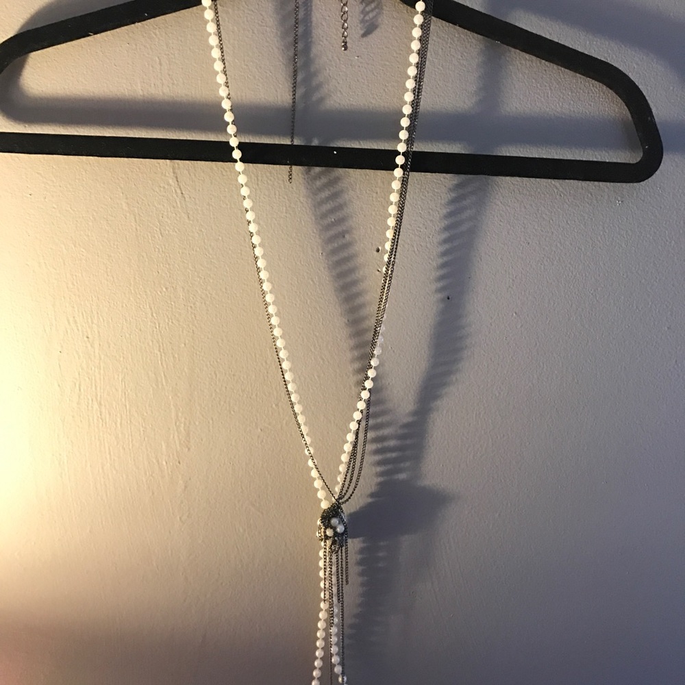 Long knotted pearl necklace