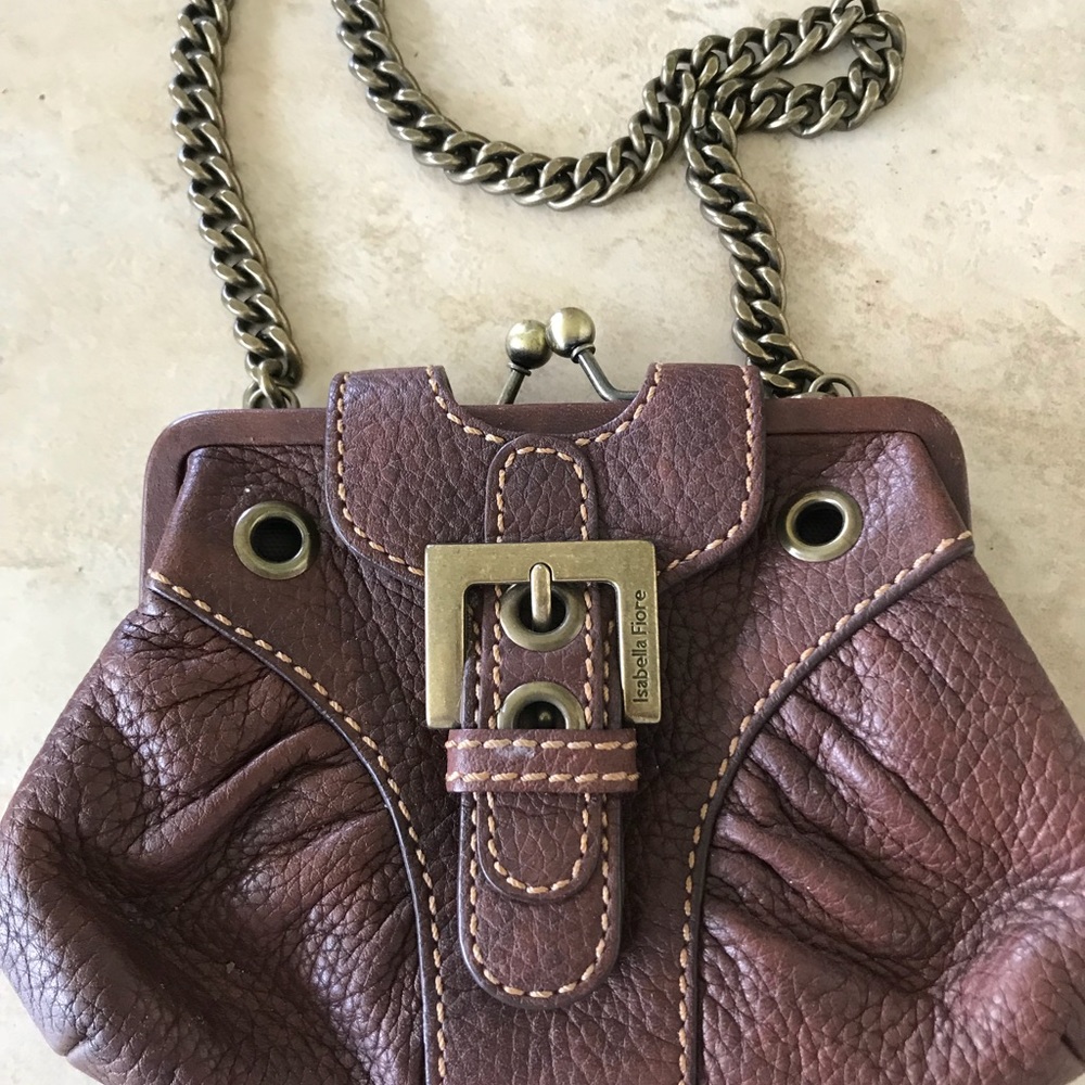 Small brown leather bag with chain strap.