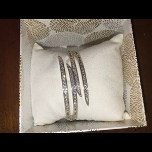 Silver tone bangle with stone accents