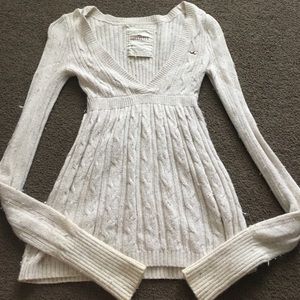 Cream sweater with deep v neck