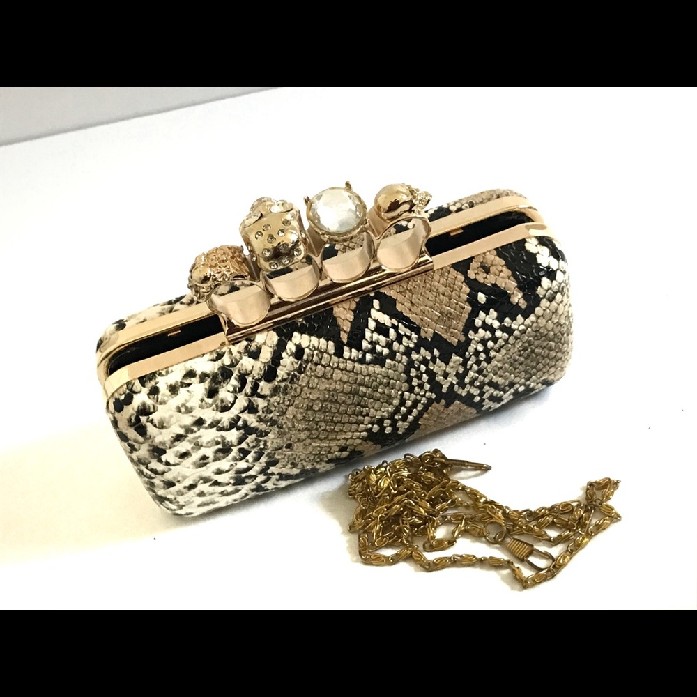 Snakeskin hand clutch with jeweled ring inserts
