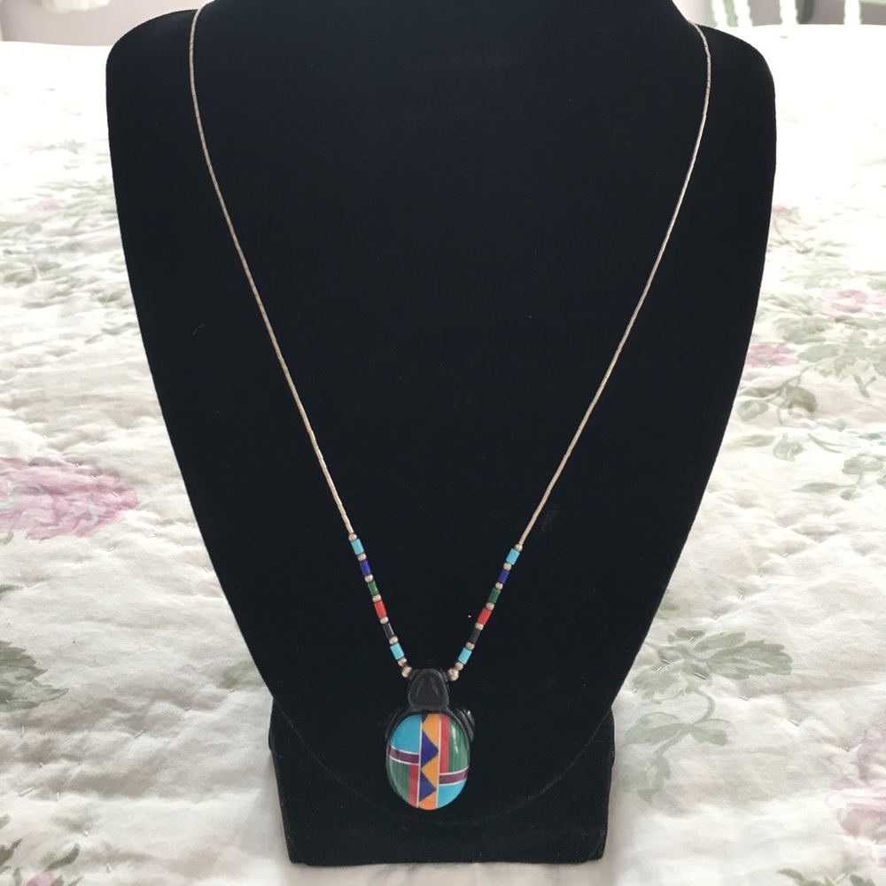 Beautiful inlaid turtle on 24 inch chain.