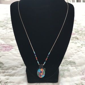 Beautiful inlaid turtle on 24 inch chain.