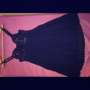 Black  pleated dress with jewelry embedded bra.