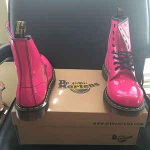 Dr Marten patent pink combat boots.