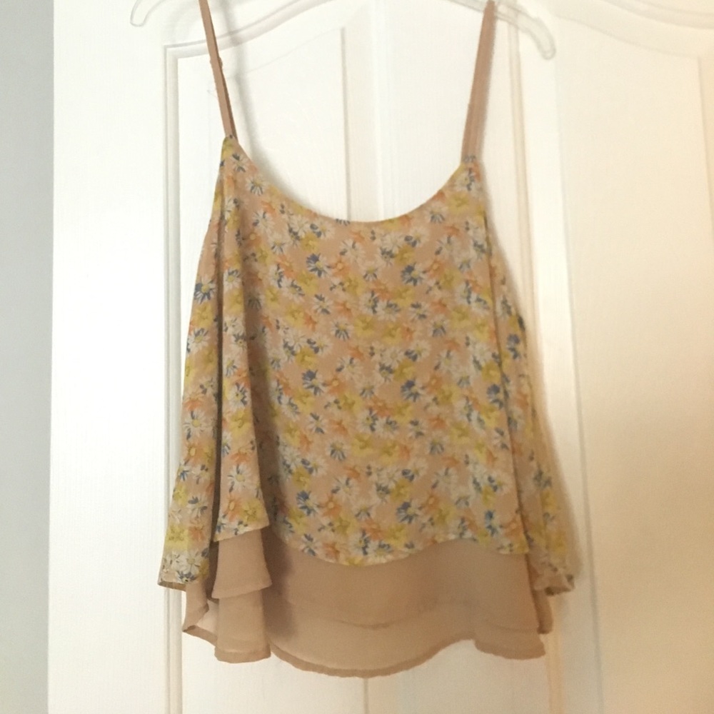 A loose, flowy tank with a daisy print.