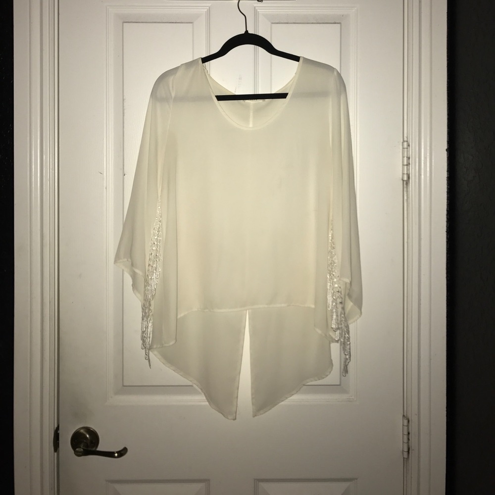 White cropped blouse with fringe on sleeves