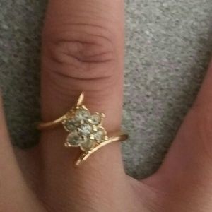 Gold tone flower ring, CZ stones