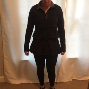 Athleta black ruffle jacket.