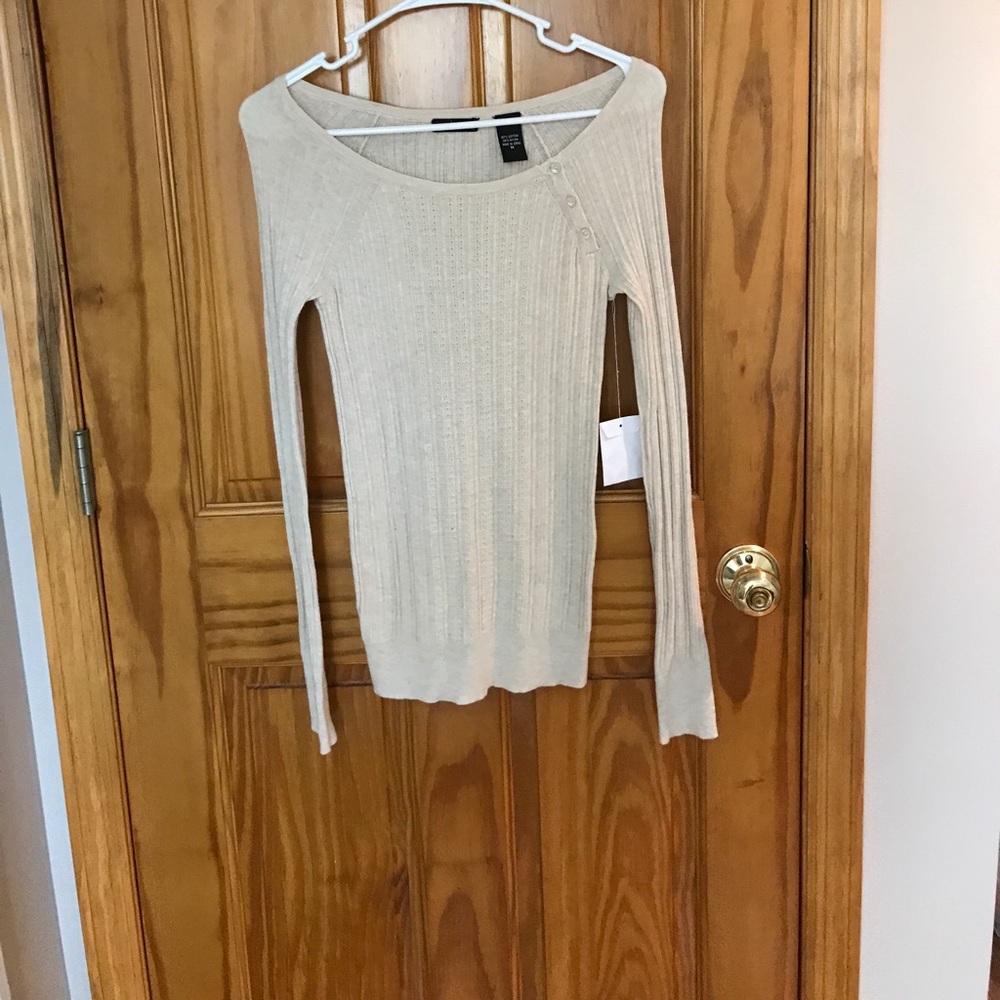 NWT. Cream colored sweater.