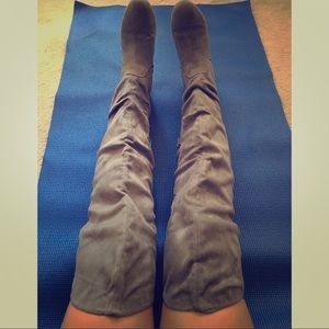 Grey, thigh-high, faux suede flat boots.