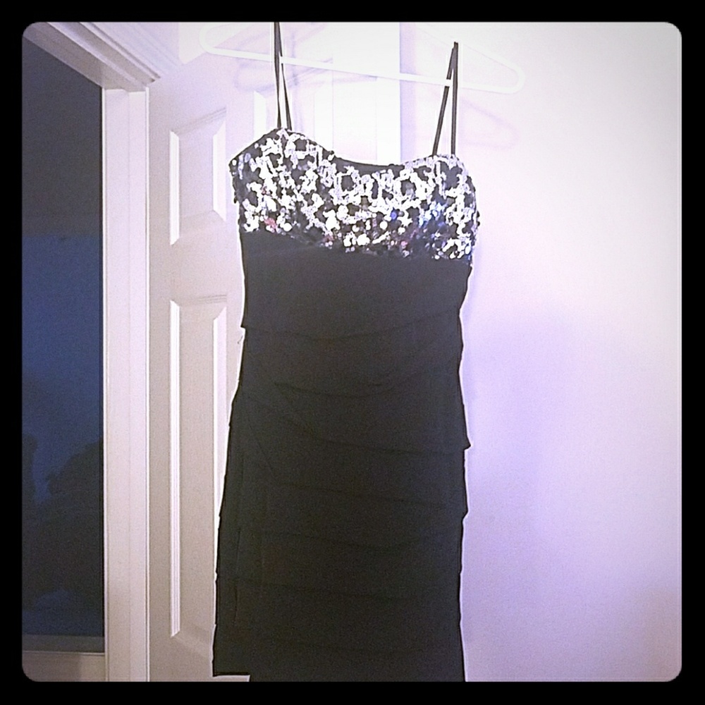 black,ruched dress with sequin top.