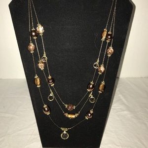 Three strand gold tone cheetah necklace